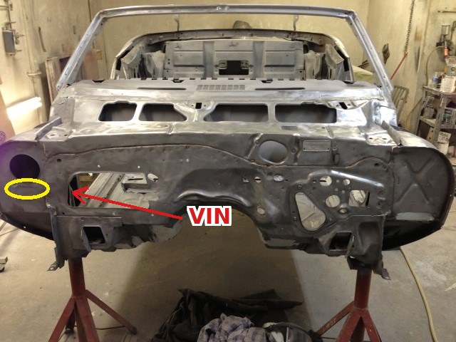 Partial VIN near the blower motor under the right fender